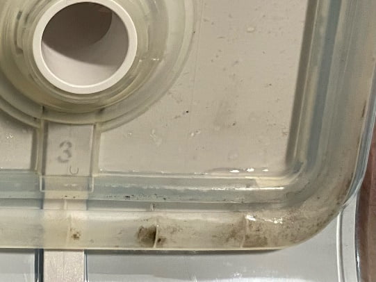 Lid of a Philips DreamStation with black residue in the lining